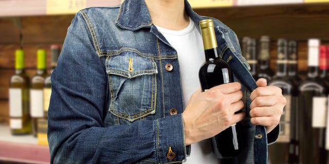 A group of men reportedly cut through the concrete floor of a liquor store and stole $18,000 worth of alcohol.