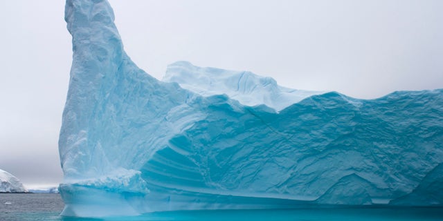 File photo: Iceberg floating off the western Antarctic peninsula, Antarctica, Southern Ocean. (Photo by Steven Kazlowski / Barcroft Media / Getty Images)