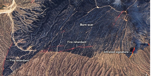 The burn scar from the Bush Fire and fire retardent lines seen in thie NASA photo from June 14, 2020.