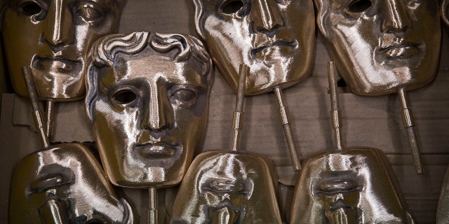 Bronze alloy masks lie in a foundry in West Drayton, Middlesex, ahead of the BAFTA awards ceremony.