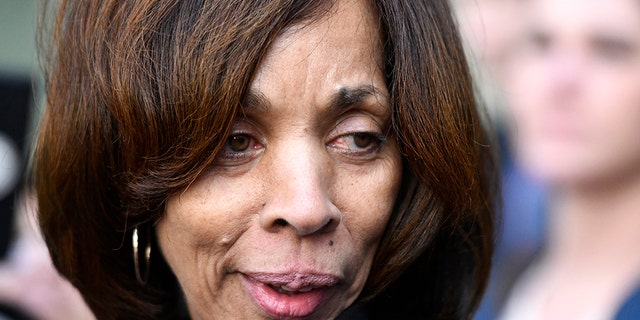 FILE - In this Feb. 27, 2020, file photo, former Baltimore Mayor Catherine Pugh leaves her sentencing hearing at U.S. District Court in Baltimore. Pugh was sentenced to three years in federal prison for arranging fraudulent sales of her self-published children's books to nonprofits and foundations to promote her political career. Pugh is expected to plead guilty to perjury. A plea hearing on the state misdemeanor charge is scheduled Friday in Anne Arundel County Circuit Court in Annapolis. (AP Photo/Steve Ruark, File)