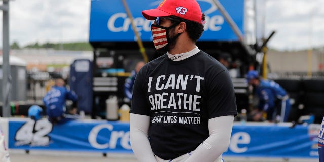 Bubba Wallace wears a "I Can't Breath, Black Lives Matter" shirt before a NASCAR Cup Series race at Atlanta Motor Speedway, June 7, 2020, in Hampton, Georgia.