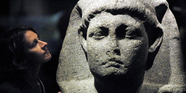 Sally-Ann Ashton admires one of the statues of Cleopatra at the launch of an exhibition at The British Museum in London 10 April 2001 - file photo.
