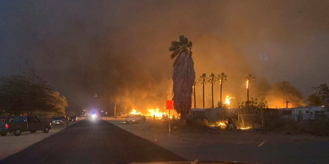 A wind-driven wildfire has destroyed about 40 homes and forced evacuations as it tore through the rural town of Niland in the Southern California desert near the Salton Sea.
