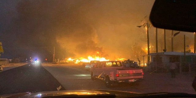 This June 28 photo provided by El Centro Fire Department shows a wildfire burning through a section of Niland, Calif.