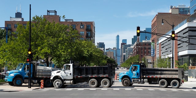 Department of Water Management trucks are used to block the northbound lanes of South Wabash Avenue, Sunday, May 31, 2020, as part of a security perimeter around downtown Chicago.