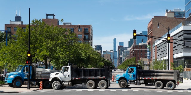 Department of Water Management trucks are used to block the northbound lanes of South Wabash Avenue, Sunday, May 31, 2020, as part of a security perimeter around downtown Chicago.