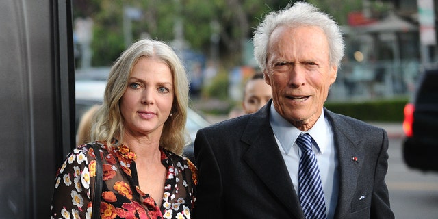 Director Clint Eastwood and girlfriend Christina Sandera attend a screening of