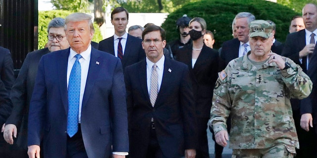 In this June 1 photo, President Trump departs the White House to visit outside St. John's Church, in Washington. Walking behind Trump from left are, Attorney General William Barr, Secretary of Defense Mark Esper and Gen. Mark Milley, chairman of the Joint Chiefs of Staff.  (AP Photo/Patrick Semansky)