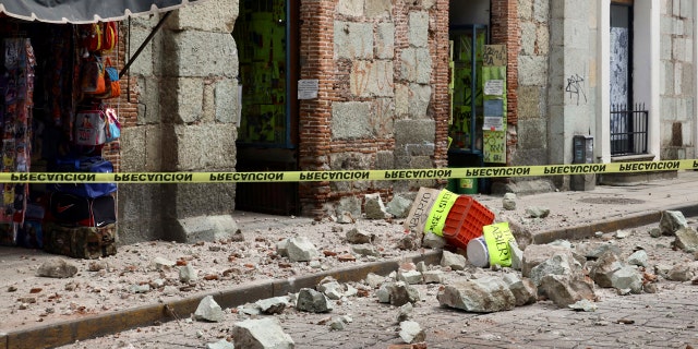 Security tape alert people of a building damaged by an earthquake in Oaxaca, Mexico,Tuesday, June 23, 2020.