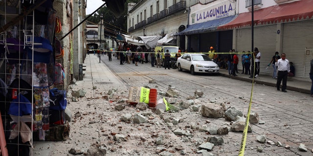 Security tape alert people of a building damaged by an earthquake in Oaxaca, Mexico, Tuesday, June 23, 2020.