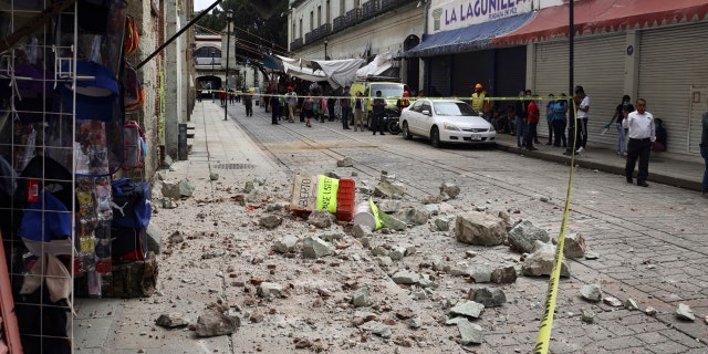 Security tape alert people of a building damaged by an earthquake in Oaxaca, Mexico, Tuesday, June 23, 2020.