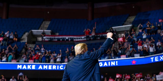 President Donald Trump arrives on stage to speak at a campaign rally at the BOK Center, Saturday, June 20, 2020, in Tulsa, Okla. (AP Photo/Evan Vucci)