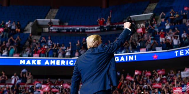 President Donald Trump arrives on stage to speak at a campaign rally at the BOK Center, Saturday, June 20, 2020, in Tulsa, Okla. (AP Photo/Evan Vucci)