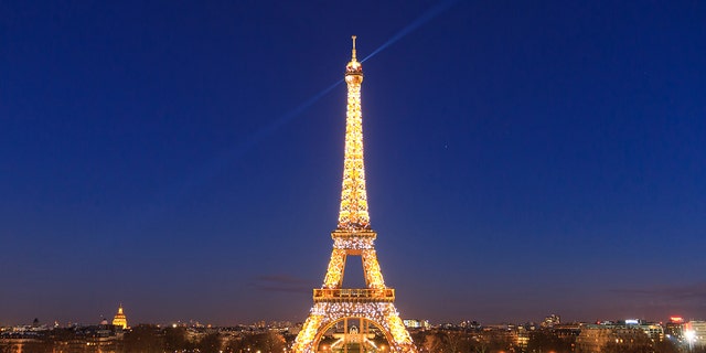 The Eiffel Tower lit up at night.