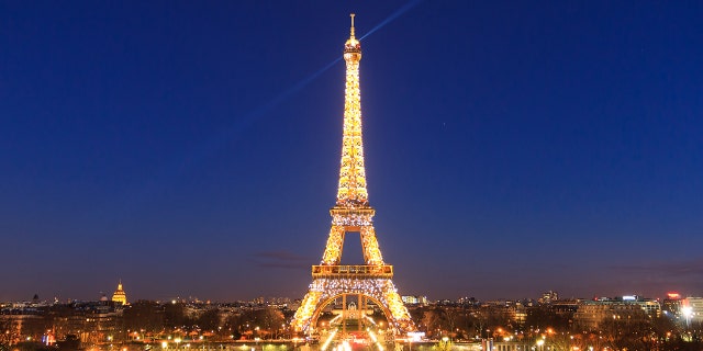 The Eiffel Tower lit up at night.