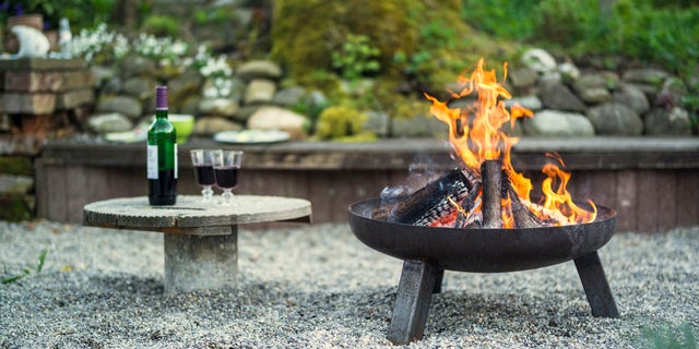 The first thing to consider when adding a fire pit is placement, which should be placed a minimum of 10-feet away from houses and neighboring yards.