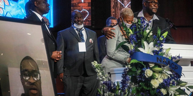 George Floyd's brother Philonise Floyd, far right, and cousin Shareeduh Tate, second from right, share their memories of Floyd at a memorial service at North Central University, on June 4, in Minneapolis. (AP Photo/Bebeto Matthews)