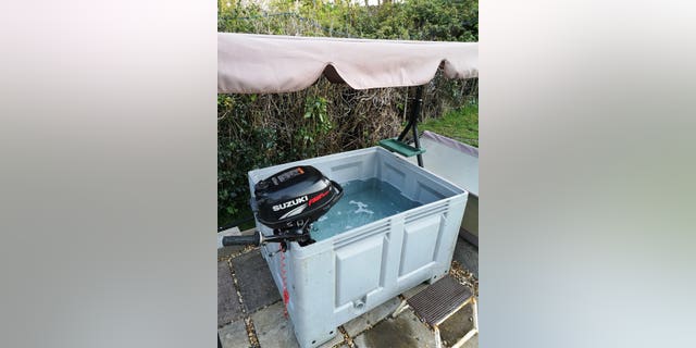 The water is cleaned using the old fish pond filtration system, which he runs through 66-feet of hose pipe sitting on his concrete path, to heat the water.