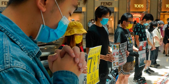 Protesters gather at a shopping mall during a pro-democracy protest against Beijing's national security law in Hong Kong on Tuesday. (AP)