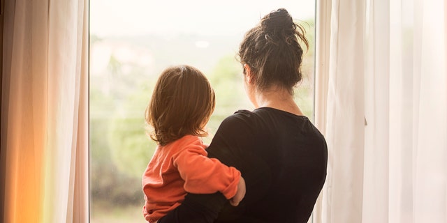 Mom holding child