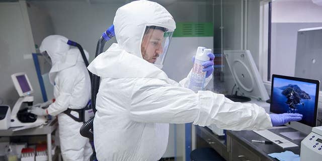 Dr. Brett Case sterilizes the suit with a disinfectant spray before treating the virus that causes COVID-19. Researchers have developed a sensory sensor that can identify a specific range of compounds. They analyzed the participants' breathing and determined that 28 compounds contained in human breathing could be used for biometrics.