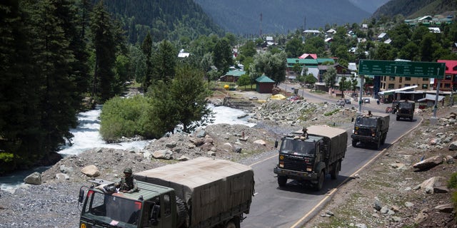 An Indian army convoy moves on the Srinagar-Ladakh highway in northeast India on Wednesday. (AP)