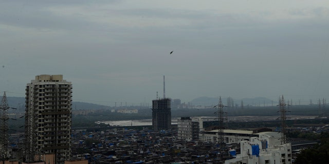 Dark clouds gather over the skyline in Mumbai, India, Tuesday, June 2, 2020.