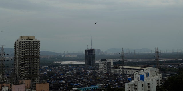Dark clouds gather over the skyline in Mumbai, India, Tuesday, June 2, 2020.