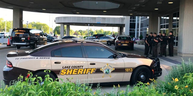 Lake County Sheriff's squad cars are parked outside of Community Hospital in Munster, Ind., Tuesday, June 16, as a fatal shooting investigation is conducted. (Lucas Gonzalez/The Times via AP)