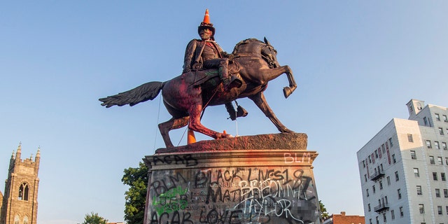 Traffic cones and a rope remained on the statue of Confederate General J.E.B. Stuart the morning after protesters against racial inequality attempted to topple it in Richmond, Va., June 22, 2020. (REUTERS/Jay Paul)