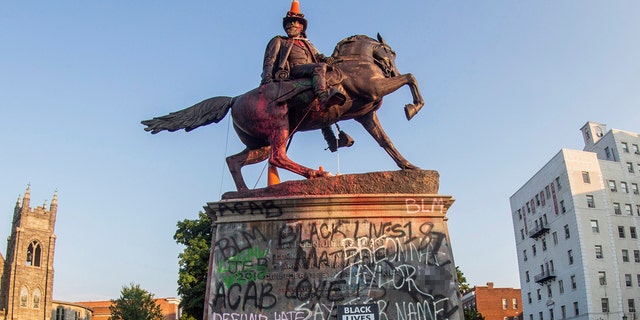 Traffic cones and a rope remained on the statue of Confederate General J.E.B. Stuart the morning after protesters against racial inequality attempted to topple it in Richmond, Va., June 22, 2020. (REUTERS/Jay Paul)