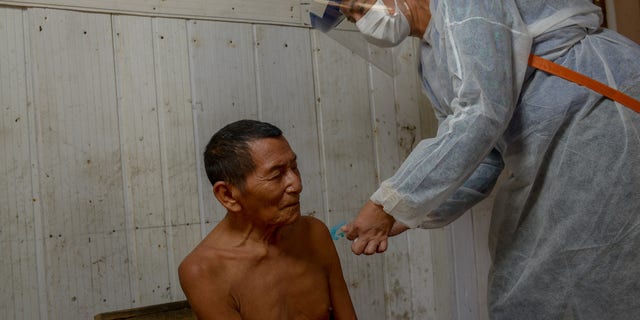 A Kokama native being examined by doctors in his tribe.