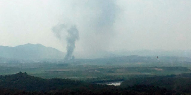 Smoke rises in the North Korean border town of Kaesong, seen from Paju, South Korea, Tuesday, June 16, 2020. South Korea says that North Korea has exploded an inter-Korean liaison office building just north of the tense Korean border. (Yonhap via AP)