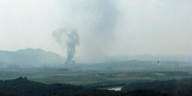 Smoke rises in the North Korean border town of Kaesong, seen from Paju, South Korea, Tuesday, June 16, 2020. South Korea says that North Korea has exploded an inter-Korean liaison office building just north of the tense Korean border. (Yonhap via AP)