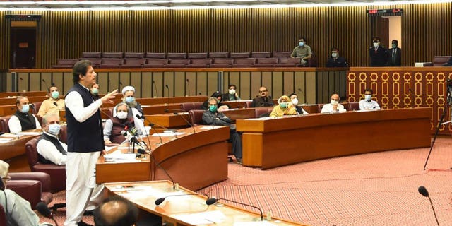 In this photo released by the Press Information Department, Pakistani Prime Minister addresses the Parliament in Islamabad, Pakistan, Thursday, June 25, 2020. Khan accused the United States on Thursday of having