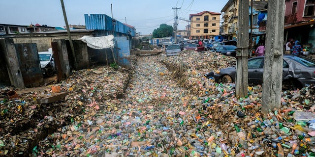 Garbage piles cover fields and streets after heavy rainfall in Lagos, Nigeria on June 7.