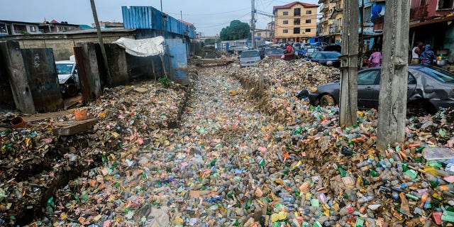 Garbage piles cover fields and streets after heavy rainfall in Lagos, Nigeria on June 7.