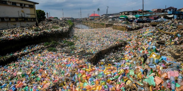 Garbage piles cover fields after heavy rainfall in Lagos, Nigeria on June 7.