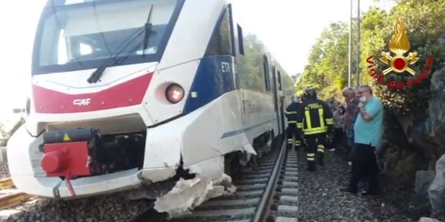 A commuter train in Italy derailed after striking boulders on the tracks after a landslide on Monday.