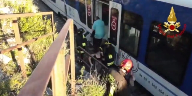 A commuter train in Italy derailed after striking boulders on the tracks after a landslide on Monday.