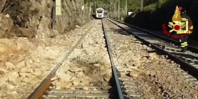 A commuter train in Italy derailed after striking boulders on the tracks after a landslide on Monday.