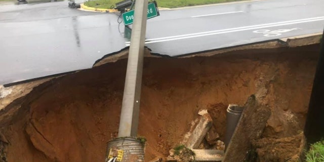 A sinkhole opened up along a roadway in Marion County, Florida, on Sunday, causing a crash.
