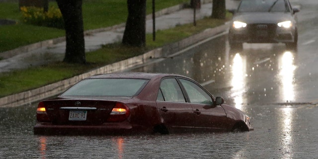 Heavy rains resulted in flooding on many streets in areas south of Boston, Sunday.