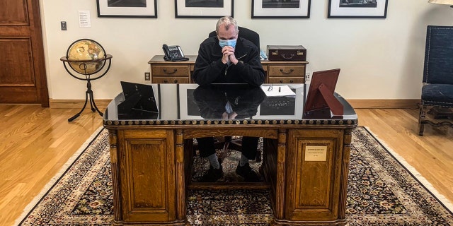 Murphy came under fire for using the historic furniture after he tweeted a photo of himself paying tribute to George Floyd from behind the desk engraved with Wilson’s name.
