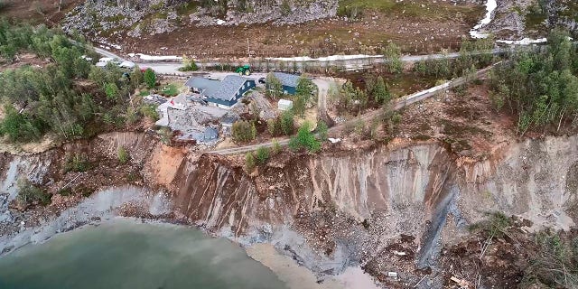 Rocks continued to fall into the bay following the powerful landslide. (Anders Bjordal/NTB Scanpix via AP)