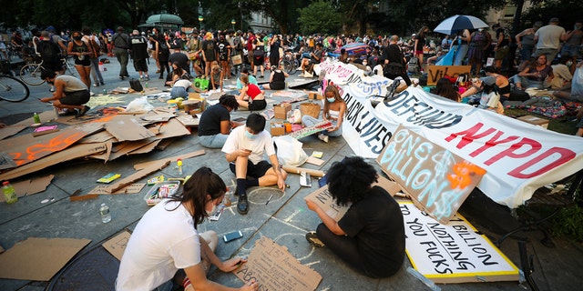 NEW YORK, USA - JUNE 24: A group of Black Lives Matter protestors prepare banners at City Hall across from One Police Plaza as part of the