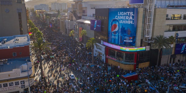 Protesters congregate at the Hollywood and Highland intersection as demonstrations continue over the killing of George Floyd despite the dangers of the widening coronavirus (COVID-19) pandemic on June 7, 2020 in the Hollywood section of Los Angeles, California.