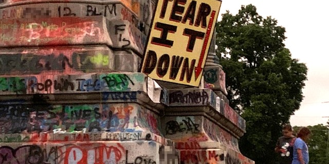 The base of the Gen. Robert E. Lee statute in Richmond, Va. is covered in graffiti.