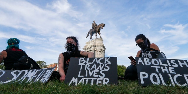 This Tuesday, June 2, 2020 file photo shows a part of a large group of protesters gather around the statue of Confederate General Robert E. Lee on Monument Avenue near downtown in Richmond, Va. (AP Photo/Steve Helber, File)